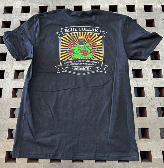 Black t-shirt with a colorful graphic design on a textured surface
